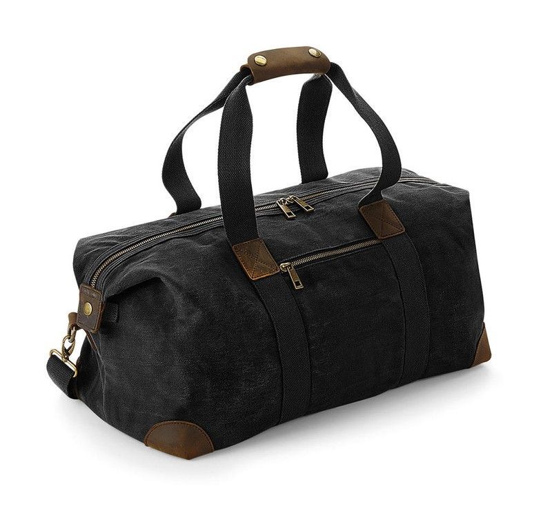 Bolsa de Viaje Heritage en Lona Encerada – 19 L, Cremallera y Bolsillo Frontal – Estilo Clásico Cuero y Latón