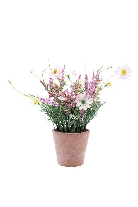 Pequeña planta de flores artificiales en color rosa con base de terracota